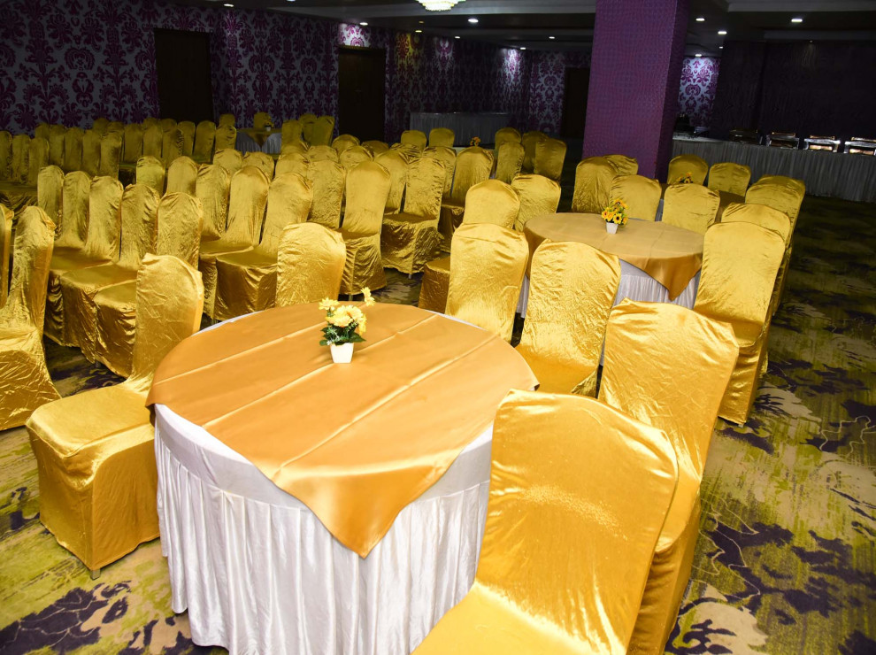 Yellow theme Chairs and Tables arrangement in Banquet Hall in Patna